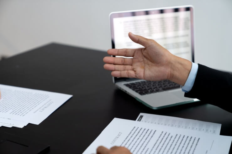 A man reaching out, explaining an idea for content